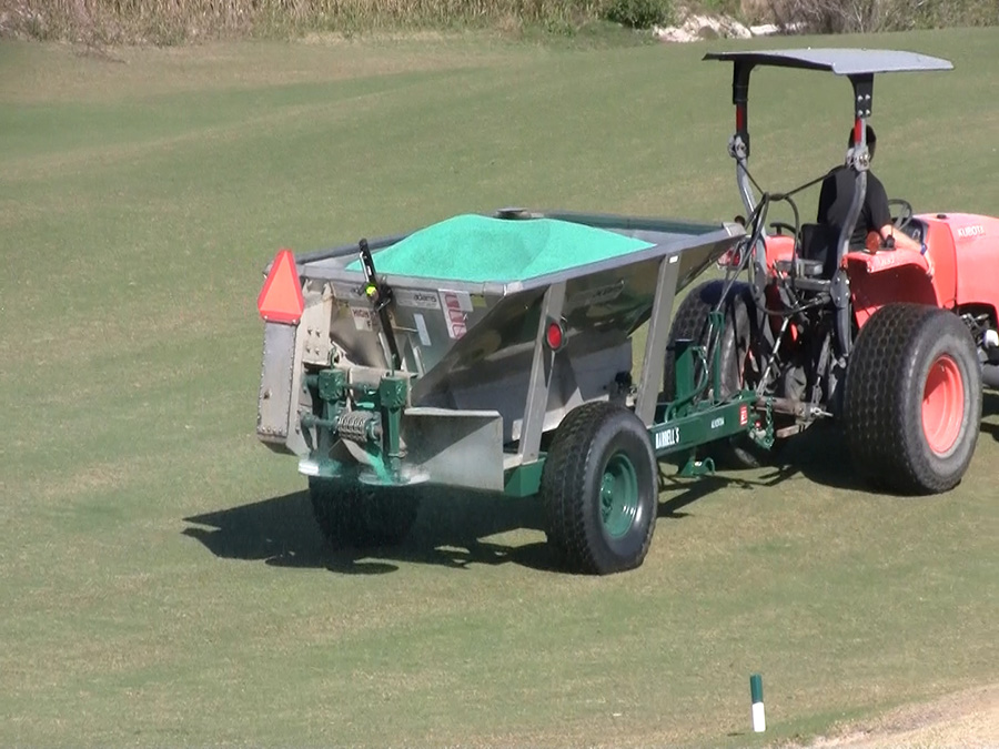 Adams 2-ton spreader on a golf course